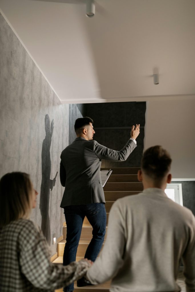 A Real Estate Broker Giving a House Tour